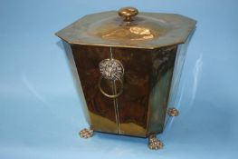 A brass tapering coal scuttle