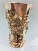 A silver plated Chinese beaker, decorated with embossed dragons