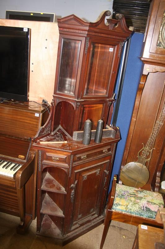 An Edwardian mahogany glazed corner cabinet