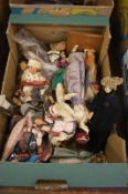 Two boxes of dolls in traditional dress, felt hat etc.