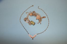 A silver charm bracelet and pendant