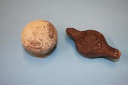 An early terracotta oil lamp and a Corinthian Aryballos