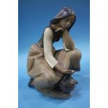 A large Lladro figure of a girl holding a flower, numbered 3525