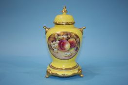 A vase and cover decorated with fruit, signed Bryan Cox