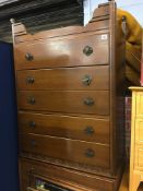 A teak chest of drawers and an oak chest of drawers