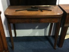 A 19th century mahogany fold over tea table