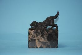 A dog on a marble base