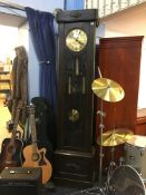 An Art Deco oak long case clock