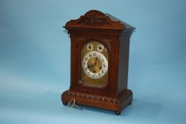 Oak bracket clock with strike action, eight day movement