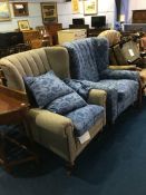 A pair of tweed style covered armchairs