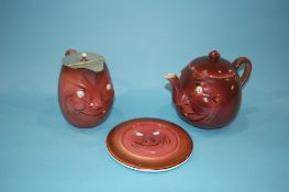 A Baker and Co. Ltd novelty tea pot, water pot and teapot stand