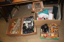 Four boxes of assorted toys and games