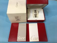 A Cartier ladies stainless steel ‘Tank’ watch, model number 2384, case number 765337 UF (boxed,