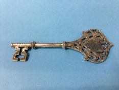 A silver key commemorating the opening of the Charles Perrins memorial cottages (Chester Le Street)