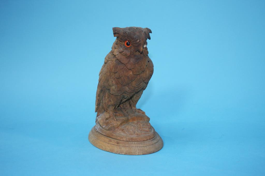 A carved wood owl inkwell