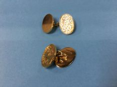 A pair of 18ct gold cuff links, weight 21.6 grams