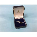 An 18ct gold diamond encrusted two leaf brooch, total weight 4.3 gram