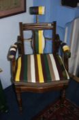 A Barber's chair with leather seat and arms