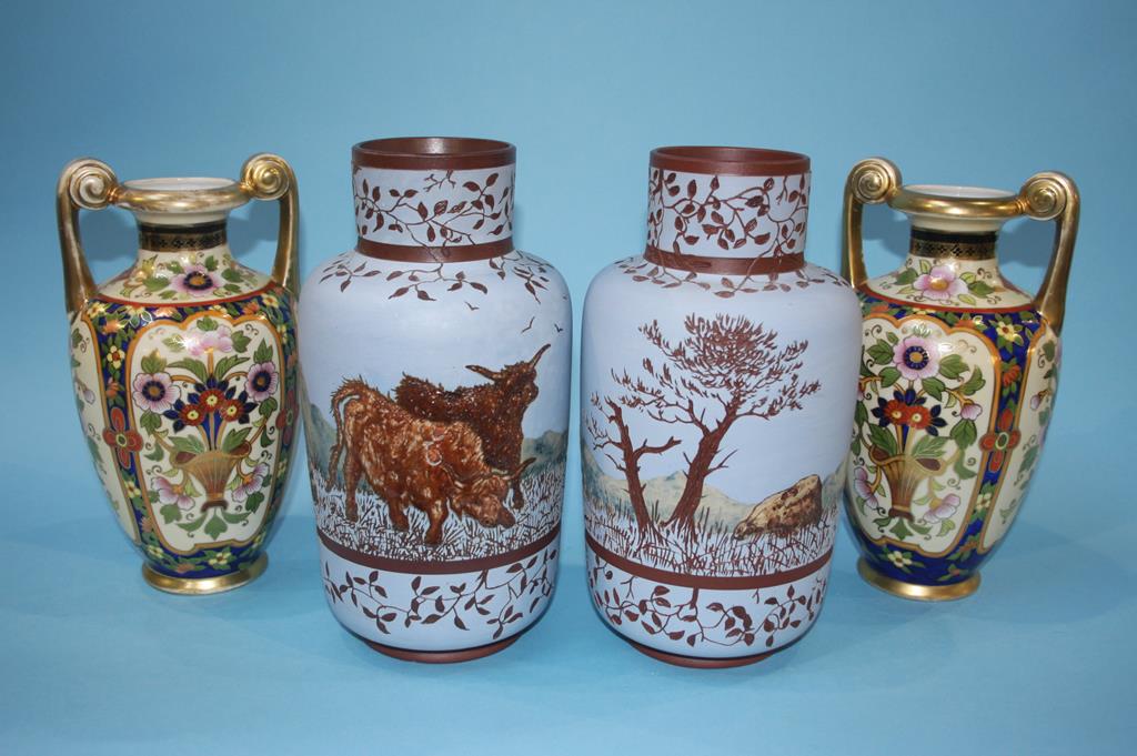 A decorative pair of Noritake vases, 24cm height and a pair of earthenware vases on a pale blue