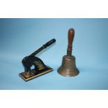 A hand bell and an address stamp