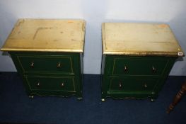A pair of two drawer green painted chests, with gold tops
