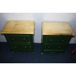 A pair of two drawer green painted chests, with gold tops