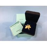 A Tiffany and Co 18ct gold flower brooch, stamped Tiffany + Co 750, weight 22 gram (boxed)