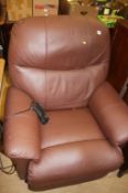 A brown rise and recliner armchair