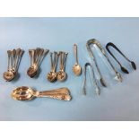 An assortment of silver spoons and sugar nips, 11.5ozts