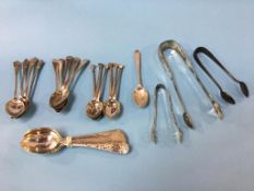 An assortment of silver spoons and sugar nips, 11.5ozts
