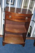 A reproduction mahogany bowfront side cabinet