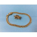 A 9ct gold bracelet stamped 375, weight 8.3 grams and a 9ct gold mounted charm