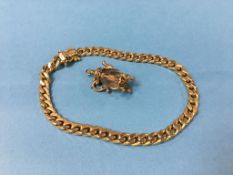 A 9ct gold bracelet stamped 375, weight 8.3 grams and a 9ct gold mounted charm