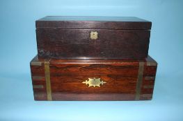 A 19th century rosewood writing box, with brass banding and an oak writing slope