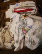 Two boxes of linen and fabrics