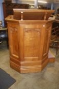 A Robert 'Mouseman' Thompson oak pulpit of panelled form with integral steps, bookshelf, seat and