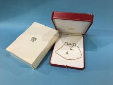 An 18ct gold Cartier diamond encrusted heart shape pendant, with round brilliant cut diamonds and an