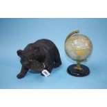 Carved bear and a globe