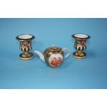 A small Continental miniature teapot, decorated with panels of cherubs, mark in underglaze blue
