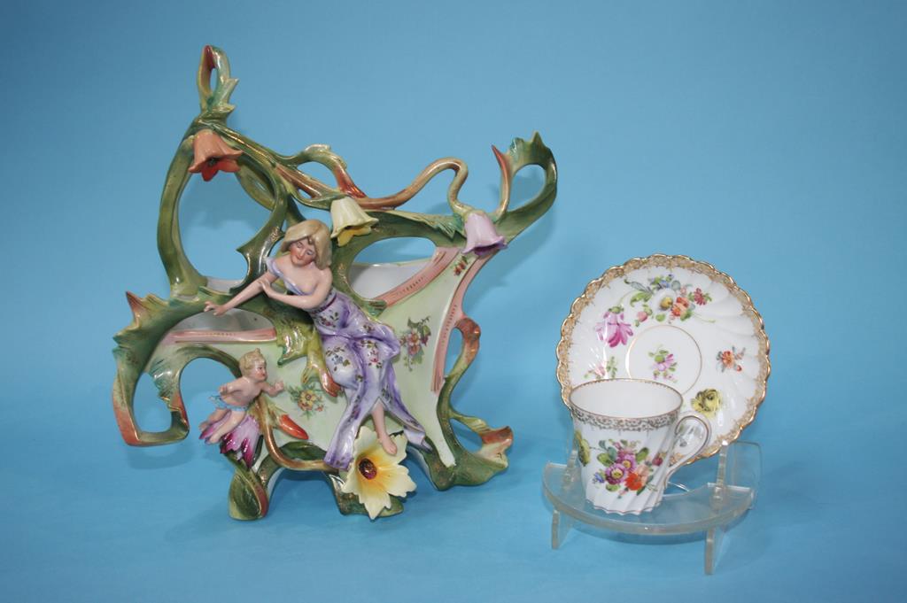 A Continental porcelain centrepiece and three Dresden coffee cans and saucers