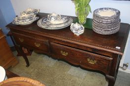An oak two drawer dresser base, with delft rack over