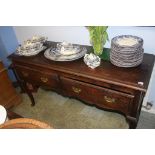 An oak two drawer dresser base, with delft rack over