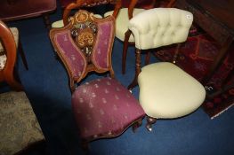 An Edwardian marquetry inlaid nursing chair and a walnut button back chair