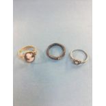 A gold cameo ring (marks obscured), a Continental white metal diamond ring and one other (3)
