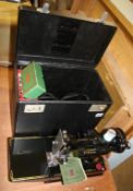 A cased Singer 221k sewing machine