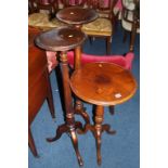 Two pedestals and a mahogany tripod occasional table