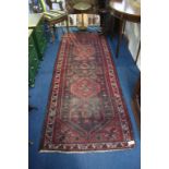 A Hamadam runner, with central medallions surrounded by floral motifs and floral border, 282cm x