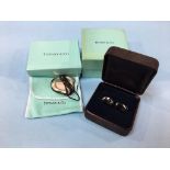 A Tiffany and Co 925 silver ‘Full Heart Pendant’ and a pair of Elsa Peretti black bean cuff links (