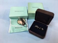 A Tiffany and Co 925 silver ‘Full Heart Pendant’ and a pair of Elsa Peretti black bean cuff links (