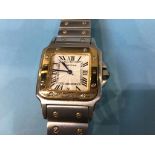A gents stainless steel wristwatch, Cartier style, etched 'Santos De Cartier Quartz Swiss made' to